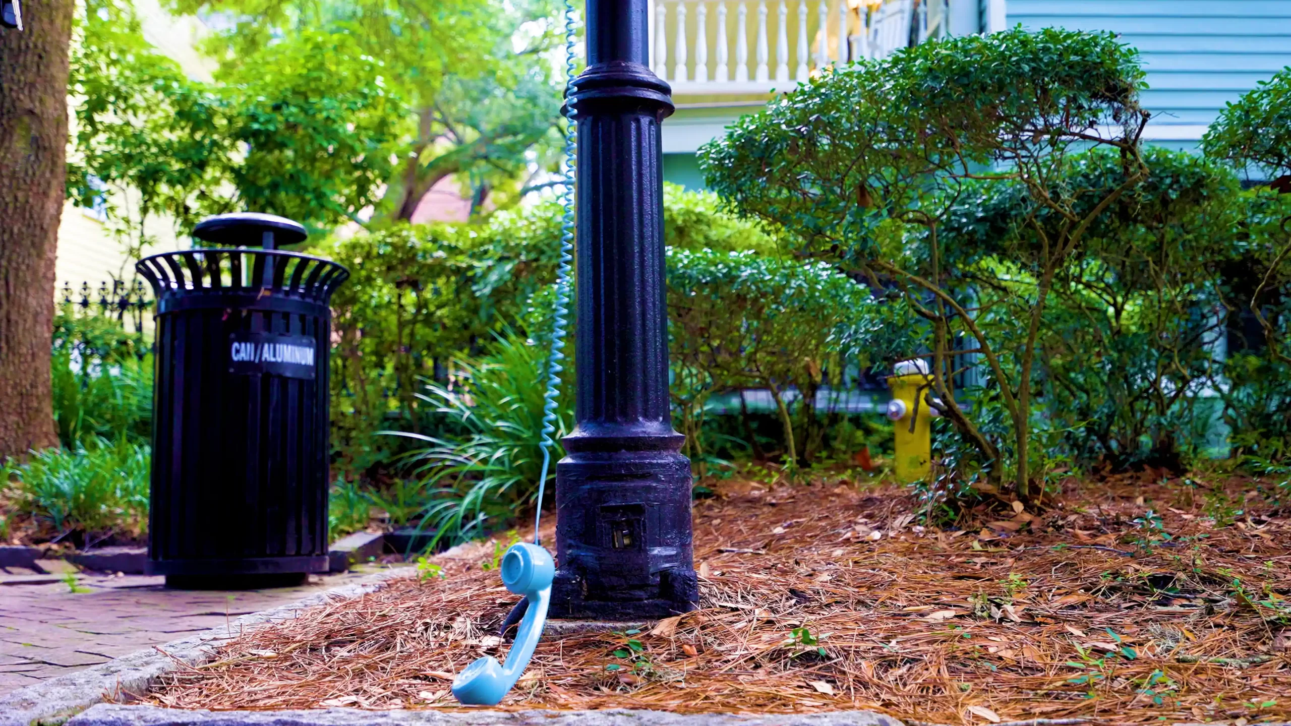 Phone hangs from a pole